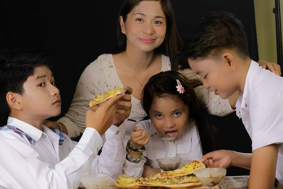 in photo: Mompreneur, Ms. Rhose Faith Hayagan together with her children