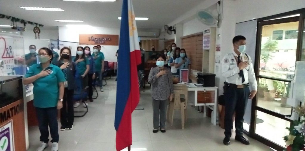 DTI Quezon staff singing the National Anthem during the Flag Ceremony for the month of January 2023.