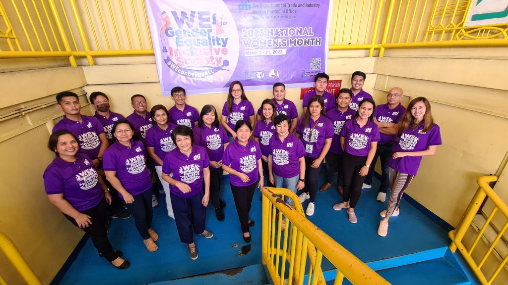 DTI Quezon, headed by PD Julieta Tadiosa, wearing purple shirt in celebration of Women's Month.