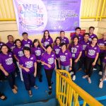 DTI Quezon, headed by PD Julieta Tadiosa, wearing purple shirt in celebration of Women's Month.