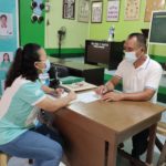Negosyo Center Guinayangan Business Counselor Nicole T. Chito coordinating with Barangay Captain Noel P. Santos of Barangay Manlayo, Guinayangan
