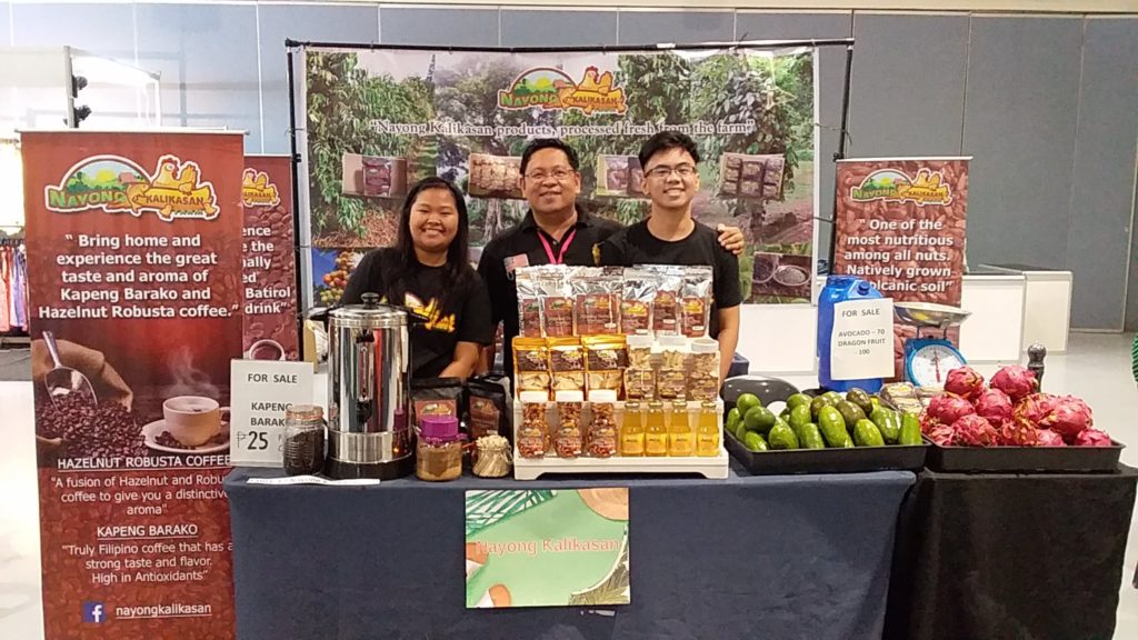 Mr. George Salinas together with children promoting Nayong Kalikasan products