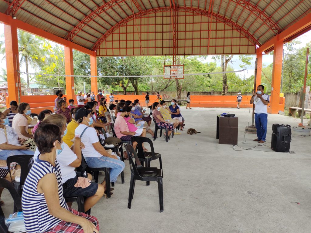 In Photo: Attendees of livelihood seeding program – negosyo serbisyo sa barangay launching whike listening to the speaker