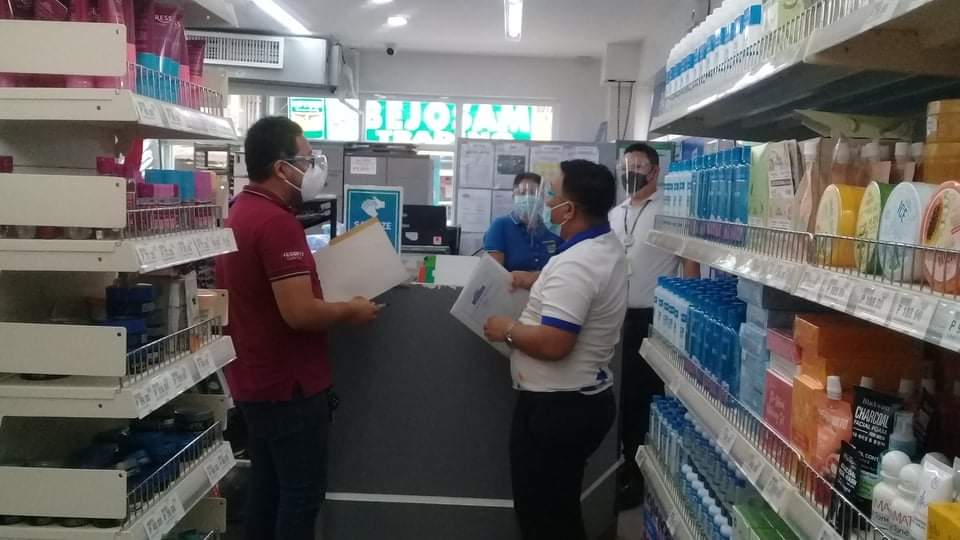 in photo: DTI Quezon personnel inspecting a drug store for Bagwis Award