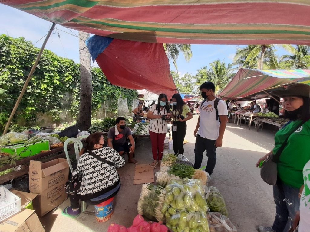 in photo: DTI Quezon and LGU team inspecting a vegetable stall