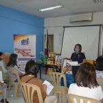 Trade and Industry Development Specialist Jonalyn A. Adaya; facilitating the event and explaining the provisions written in the Pledge of Commitment