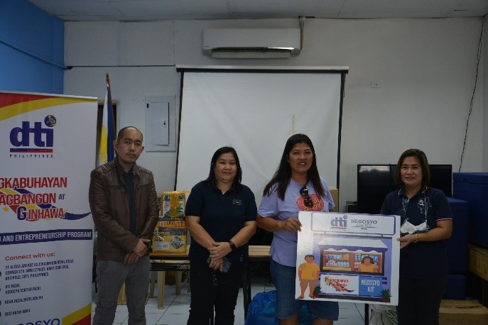 DTI Rizal together with one of the livelihood kit beneficiaries.