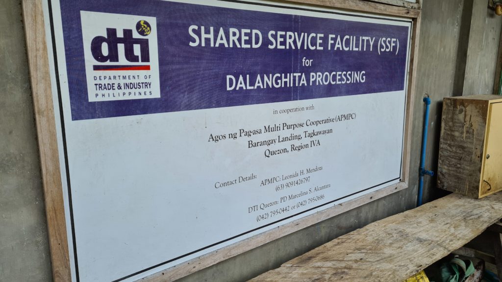A tarpaulin containing details about the Shared Service Facility for Dalanghita Processing