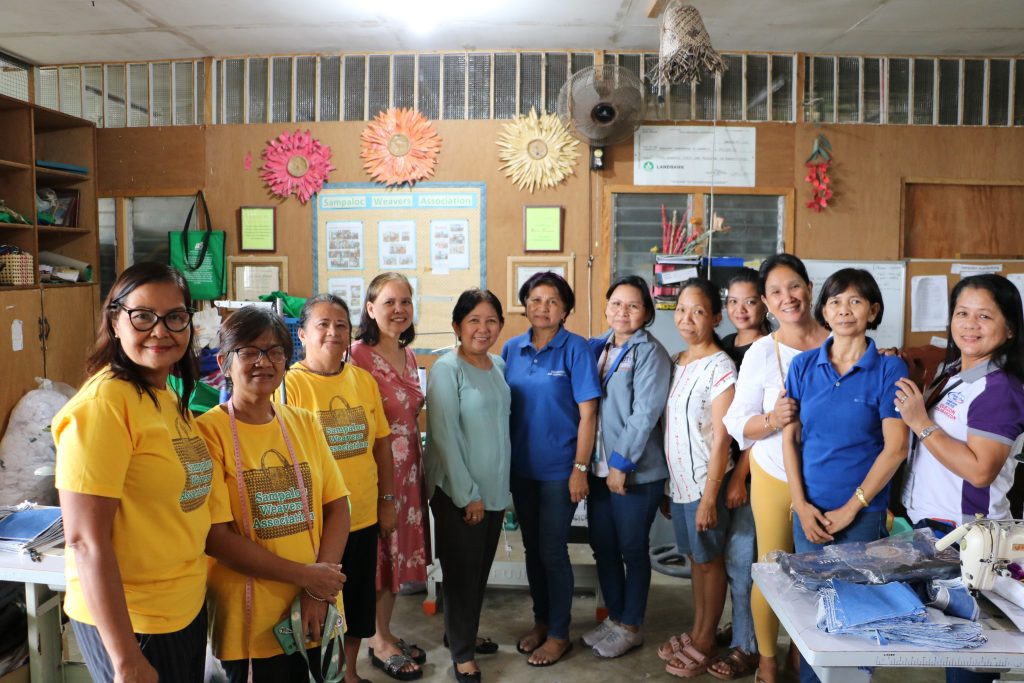 DTI Quezon Provincial Director Julieta L. Tadiosa, together with Senior Trade-Industry Development Specialist (STIDS) Ma. Graciela C. Ledesma with the members of the Sampaloc Weavers Association, led by their president, Ms. Ofelia Gagan.