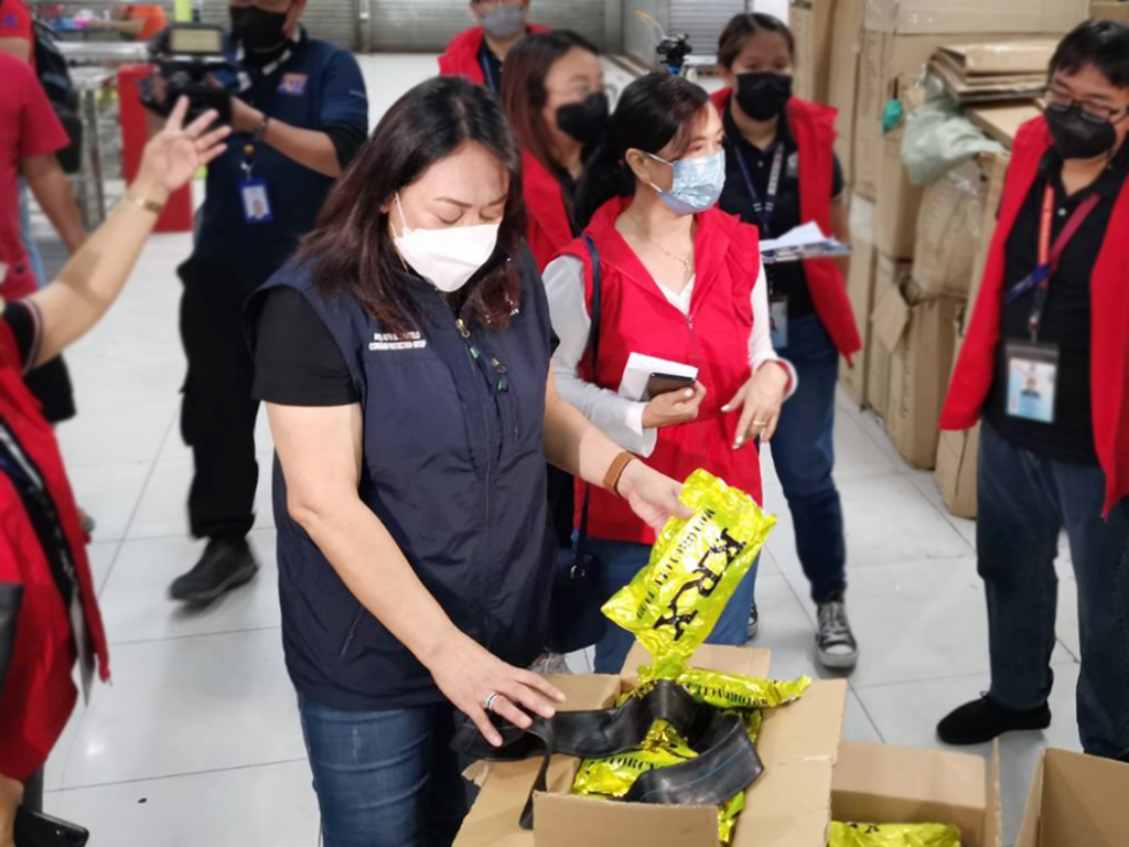  Consumer Protection Group (CPG) Undersecretary Atty. Ruth B. Castelo and Fair Trade Enforcement Bureau (FTEB) Officer-In-Charge Director Atty. Marimel D. Porciuncula inspect confiscated inner tube from a firm in Binondo, Manila. 
