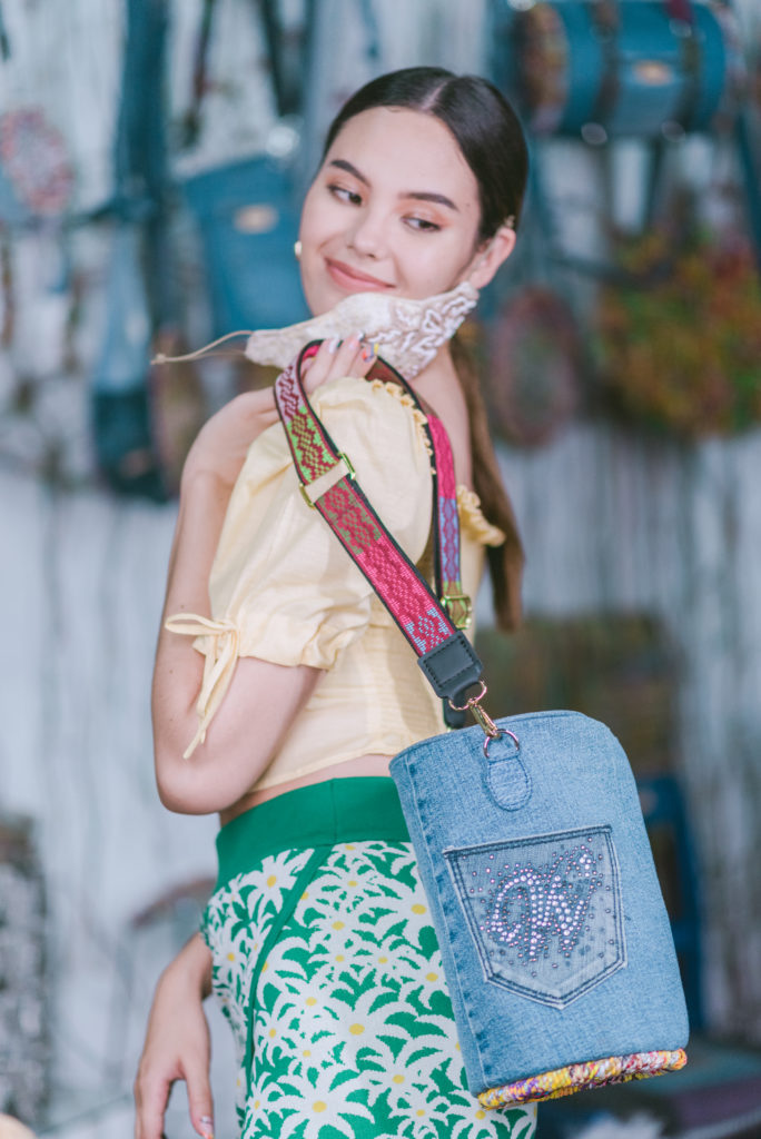 Catriona Gray showcasing an upcycled bag from Junk Not Handicraft