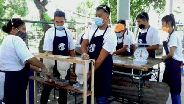 PSC members during the skills training on dressed chicken preparation.