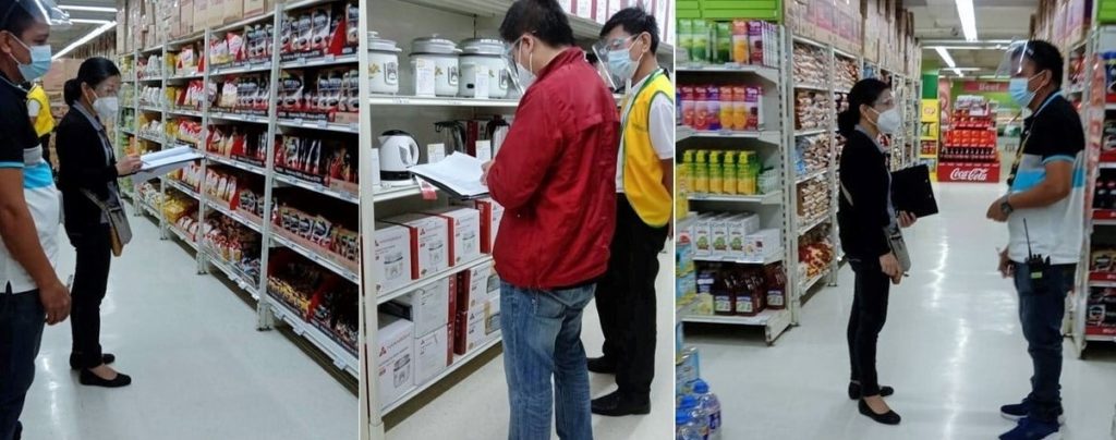 Photo of DTI official inspecting grocery stores